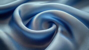A blue satin fabric with a swirl pattern photo