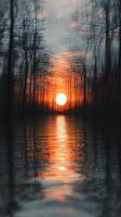 A blurry photo of the sun setting over a lake