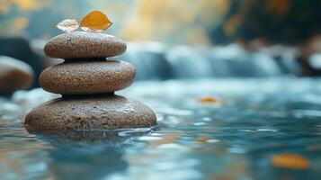 Tranquil stacked stones at a peaceful stream in a misty forest during autumn photo