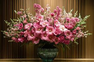 A vase filled with pink flowers sitting on a table photo