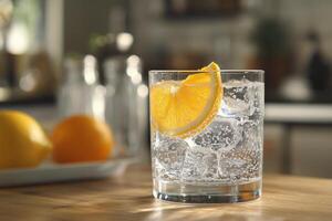 A glass of water with an orange slice on top photo