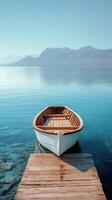 A boat sitting on a dock in the water photo