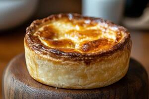 A pie sitting on top of a wooden table photo