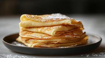 A stack of pancakes on a plate photo