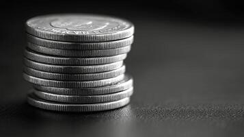 A black and white photo of a stack of coins