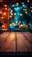 An empty wooden table in front of a blurred background photo