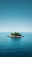 An island in the middle of the ocean with trees photo