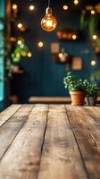 Wooden table with potted plants and light bulbs photo