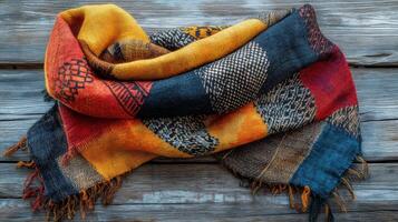 Stylish scarf draped elegantly on a wooden table showcasing vibrant colors and patterns photo