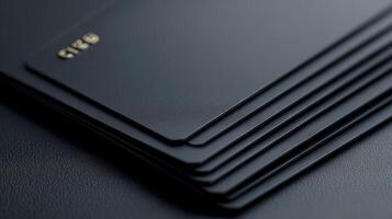 A stack of black business cards on a table photo
