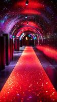 A tunnel with red lights and a red carpet photo