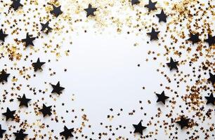 Decorative black and gold star confetti on a white background for celebrations and events photo
