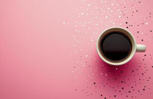 Coffee cup on pink background with silver star confetti creating a fun, cheerful atmosphere photo