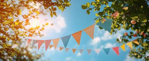 Colorful bunting flutters in the breeze at a sunny outdoor celebration photo