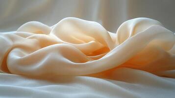 Soft fabric drapes on a smooth surface illuminated by gentle sunlight highlighting textures photo