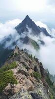 A mountain with clouds and fog on top photo