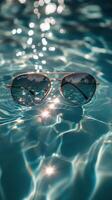 Sunglasses in the pool photo