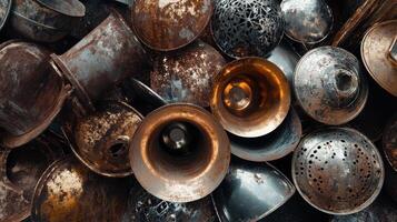 Assortment of rusty metal bowls cups and other vessels photo