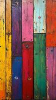 A colorful painted wall with many different colored boards photo