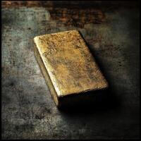 Rectangular golden bar resting on textured surface creating shadow photo