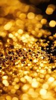 Golden glitter and bokeh create a luminous abstract scene photo