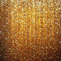 Dazzling golden shimmering sequins cascade downwards in a luxurious display photo