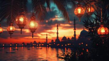 Islamic lanterns hanging over the water at sunset photo