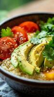 Couscous with avocado, tomatoes, and cilantro photo