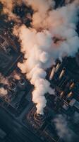 Aerial view of industrial plant with smoke coming out photo