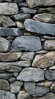 Close up view of dry stacked stone retaining wall photo