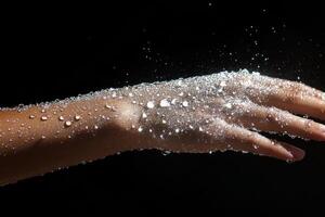 A person's hand is covered in white powder photo