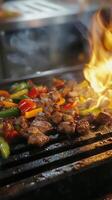 A grill with meat and vegetables cooking on it photo