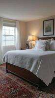 A large bed with white sheets photo