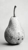 A black and white photo of a pear