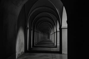 Black and white photo of a long hallway