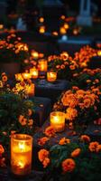 Orange flowers and candles in a cemetery photo