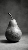 A black and white photo of a pear