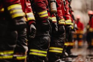 A group of firemen standing in a row photo