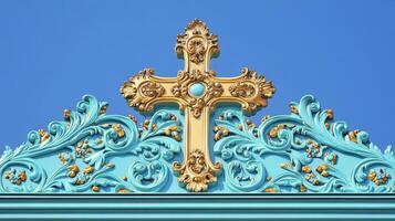 Gold cross on blue background photo