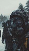 A group of people wearing gas masks in the snow photo
