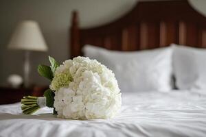 A bouquet of white flowers on a bed photo