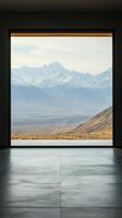 View from an old window showcasing rolling hills and mountains under a clear sky in the morning light photo