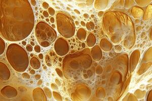 Abstract golden porous structure resembling sponge or honeycomb pattern photo