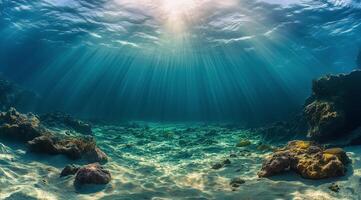 Beautiful underwater landscape with sunlight filtering through the ocean surface photo