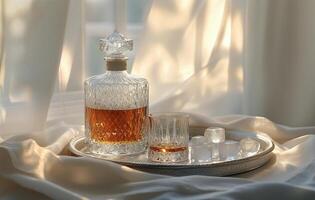 Elegant glassware set with whiskey on a tray during warm afternoon light photo