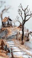 Miniature desolate landscape with shack and bare trees showcased photo