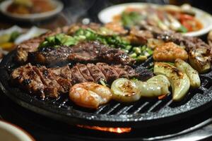 A grill with meat and vegetables on it photo