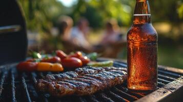 A bottle of beer and steak on a grill photo