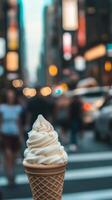 An ice cream cone in a city with people walking by photo