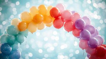 A rainbow arch made of balloons is shown photo